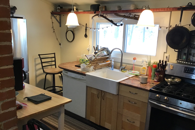Kitchen with ssfridge, granite counter top, oversized sink, air fryer, microwave, dishwasher, gas stove, pantries, coffee stand, tea cabinet - Pearl Cottage in the Historic Northampton Community of Laurel Park Apartments