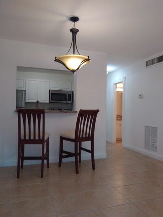 Dining area with pass through to kitchen - Best Location Between Grove/Gables, JMH/UM, Rosenstiel/NOAA Condo