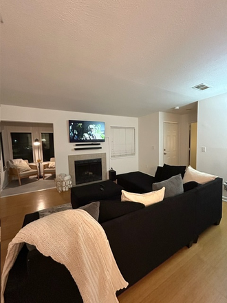 Living Room looking into Sunroom - Unbeatable Location! Condo by the Bridge to Downtown & Beach