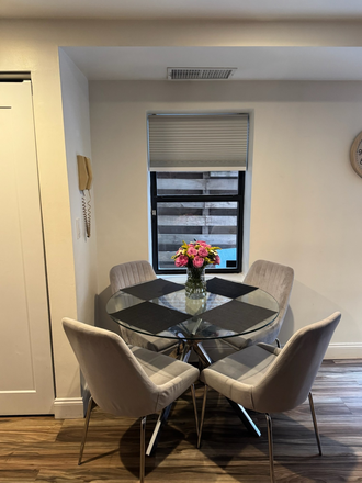 Breakfast table overlooking private back patio. - Newly renovated and furnished apartment, 3min from Campus and Whole Foods, back patio access.