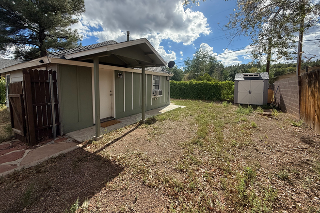 fenced yard/front door - Room in small house 10-15 min drive from North campus