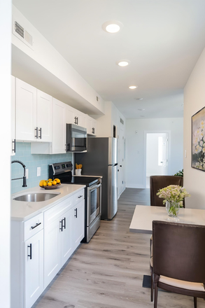 Kitchen - NEWLY RENOVATED PROPERTY WITH TONS OF AMENITIES Triplex