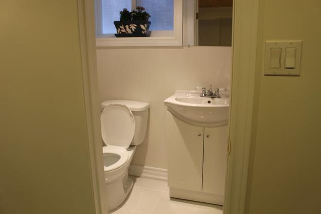 washroom with tiled shower stall - Great quiet neighbourhood Apartments