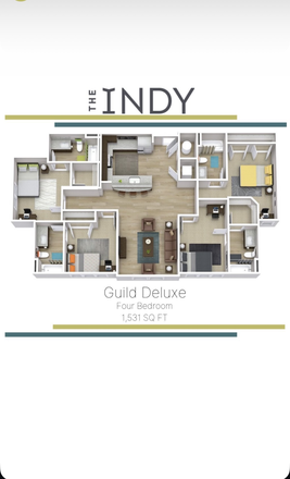 The bedroom behind the couch with a walk in closet - The Indy apartments