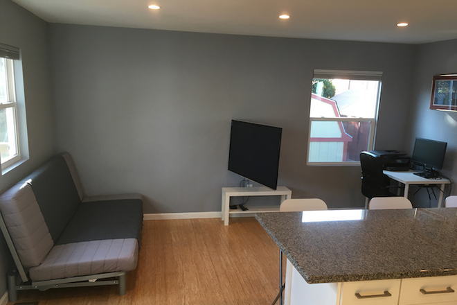 TV rotates for viewing - Fully furnished, large, 1bdrm in-law unit behind family home. High walkability and biking rating.