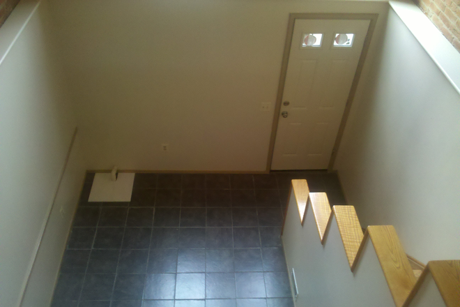 View down into atrium from middle level - 2br - 1092ft2 - 2BD/1.5BTH, UNIQUELY BEAUTIFUL Home for Rent in Ridgely's Delight!!!