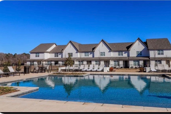 Pool area - Spacious Townhome Right Near Campus
