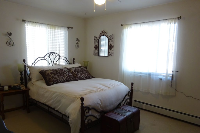 Master bedroom with bed - POOL, PARKING, PETS WELCOME Condo