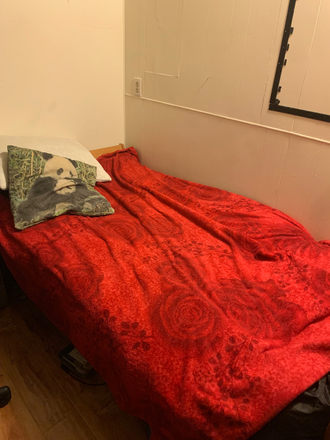 bed and side wall - Subleasing cozy room in convenient location by BART station at South Berkeley Rental