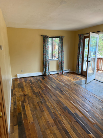 Hardwood floors and open floor plan - MOUNTAIN LIVING IN THE CHARMING TOWN OF NEDERLAND-23 MINUTES FROM CAMPUS Duplex