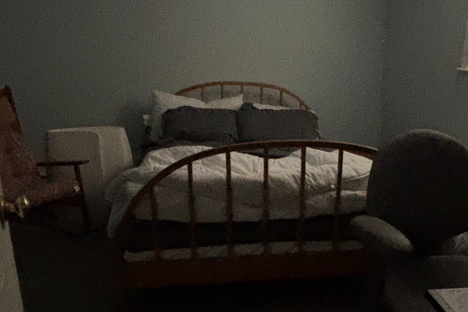 bedroom closet set of drawers  rocking chair  desk queen bed - walk to campus  furnished bedroom shared kitchen /living area Condo