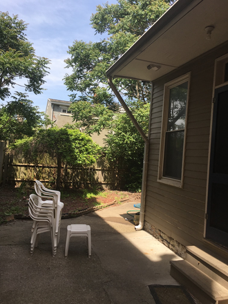 Backyard area - Nicely finished 4 bed , 2 bath 3 story house just South of campus. Only 8-9 minute walk to campus.