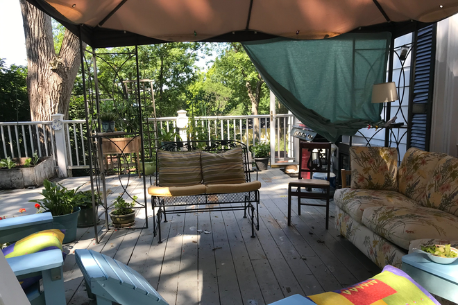 Under canopy on big deck - Burlington south end hill section.  large bright bedroom House