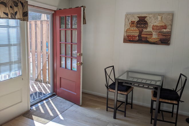 Dining area (bigger table now) and entrance - Furnished 1BR apartment close to GMU and downtown Fairfax City