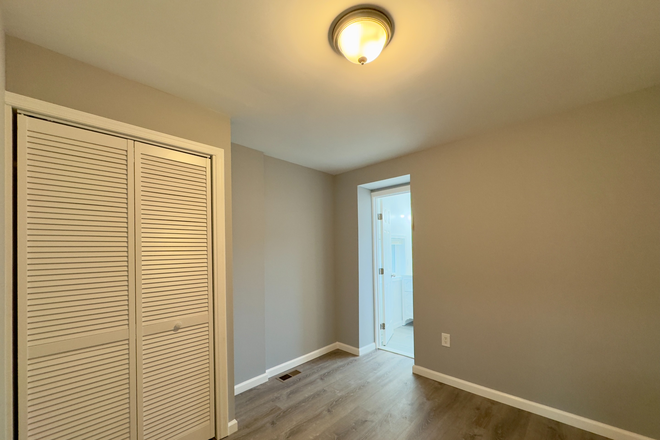 Bedroom with large closet space. All rooms are Luxury vinyl flooring. - Completely Renovated Central Air Property Right Next to Hopkins Townhome