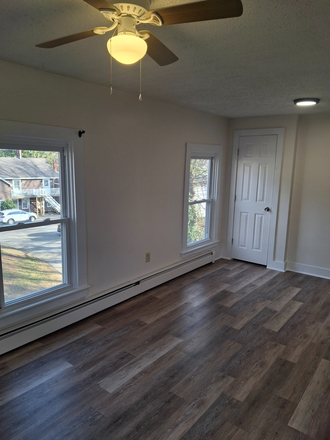 Living Room - Easy 20 Minute Commute! HEAT & HOT WATER INCLUDED! Apartments