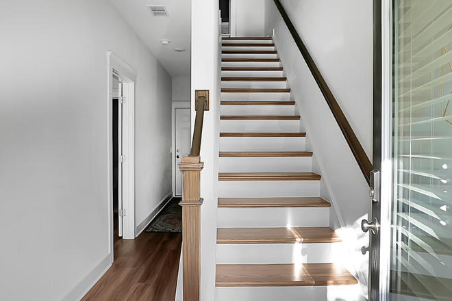 Entryway Stairs, Bedroom 1 & Garage - Executive Suites at Park Circle Townhome