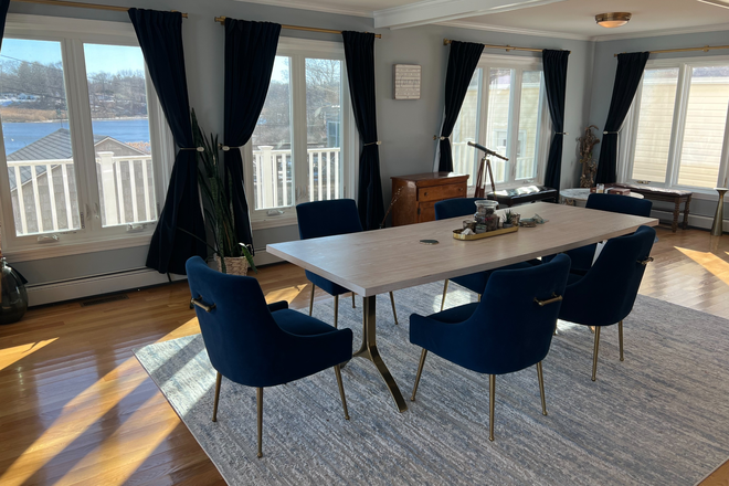Open concept dining room with water views - Large home with beautiful water views close to campus and TF Green
