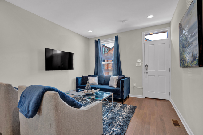 Living room - Your home away from home, with parking! The JH Shuttle Stops Here!