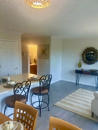 Living room and Kitchen Area when it was Furnished; Not Currently Furnished - Spacious Townhome Near UC, Hospitals, FC Stadium, Dining, OTR and Downtown - Available Immediately