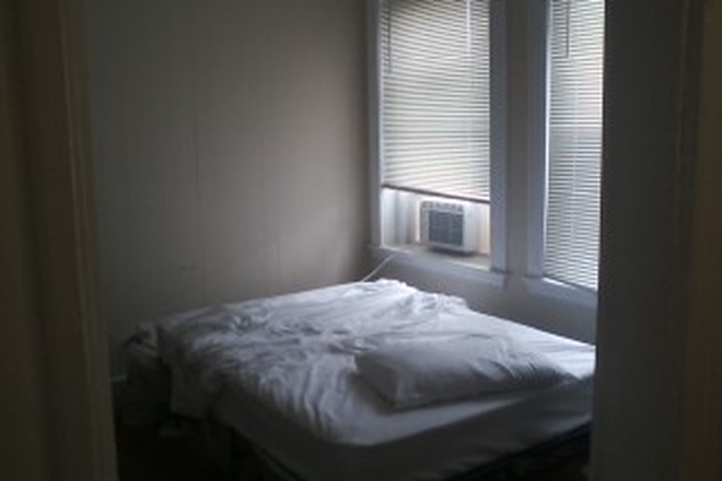 Visit hubrealtyproperties.com - Handy 2 bedroom with newly updated kitchen and breakfast bar, on the green line T Apartments