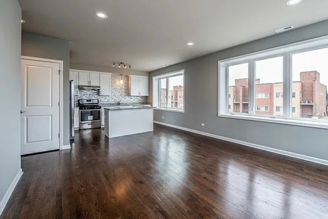 Living room/ Kitchen - Room available 1 mile south of east campus