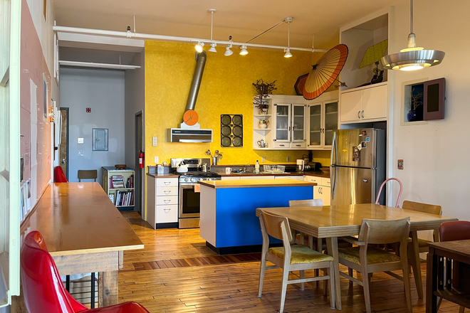 View from living room into dining and kitchen area. Tons of storage space in kitchen and entryway, including coat closet and hooks. - Furnished South End loft apt. Jan 1, 2026. Live alone: I only work here daytime M-F. Walk to BUMC