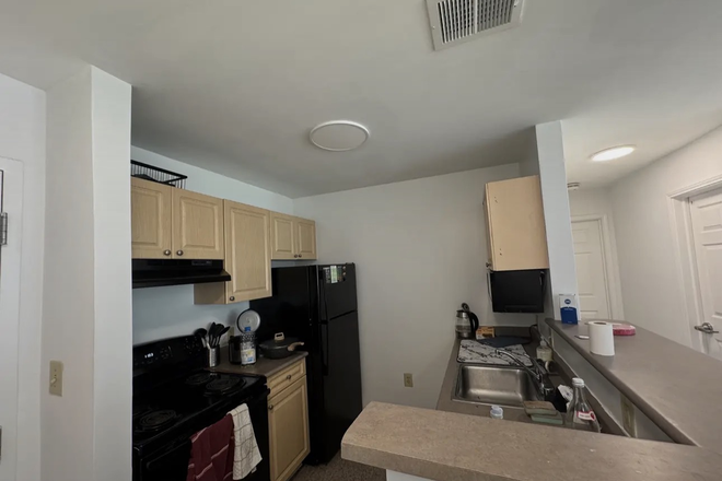 Kitchen - South campus common 1 Apartments