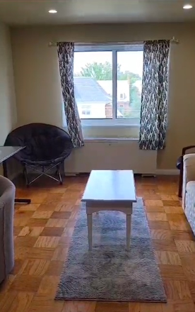 Living Room/ Furnished w/ couch, chair, and computer table - College Park Towers (Knox Building) Unit 605 Condo