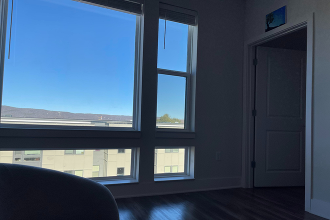 Common Space View of Window, Mountain Range, Bedroom Corridor - Union Blacksburg Luxury Apartments