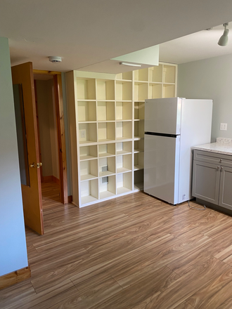 The entry door is to the left of the cubbies and a closet is to the left of the entry door. - Studio apartment