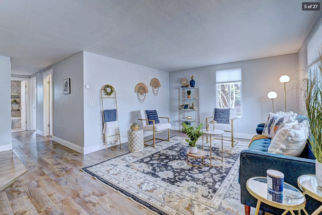 Living Room area - 3-bedroom house, just north of Campus. Off-street parking.