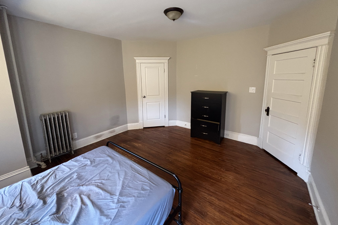 The bedroom for rent. The dresser is available for the subletter - Sublet available in Charles Village Row House