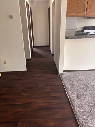 Hallway to bedrooms. Linen closet in hallway - Huge corner 2-bedroom
