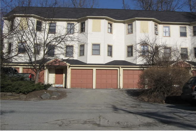 Exterior, showing front entrance and two garage doors - Furnished condo walking distance to campus