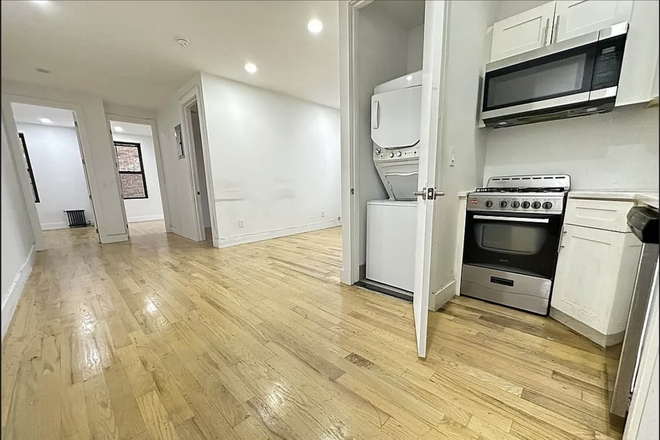 Kitchen & living room from entryway - Room Available in Prospect Park South Apartments