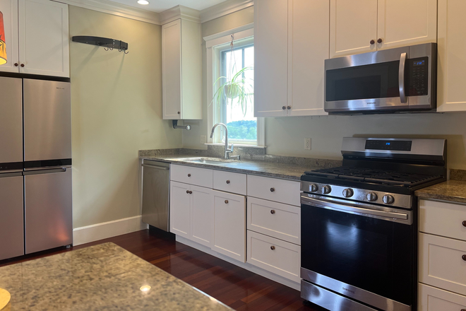 Kitchen with gas stove, dish washer, microwave, disposal, refrigerator - 3-bedroom Apt. in beautiful 2-family - steps to bike path, bus, restaurants, Spy Pond