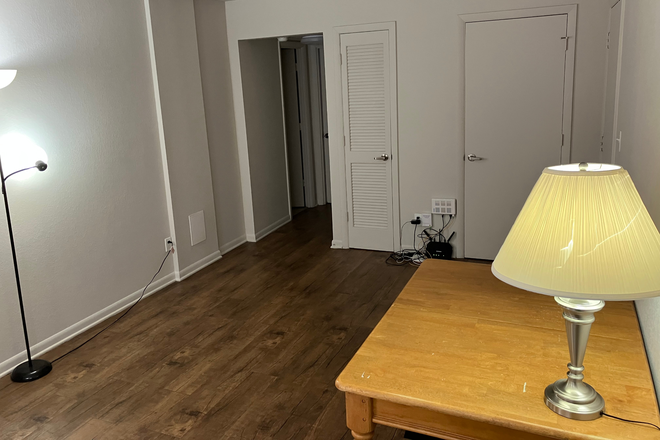 Living room, with bathroom door visible on the left - Spring 2026 Lease Takeover - University Crossing 1br/1ba, close to Payless and 42 bus Apartments