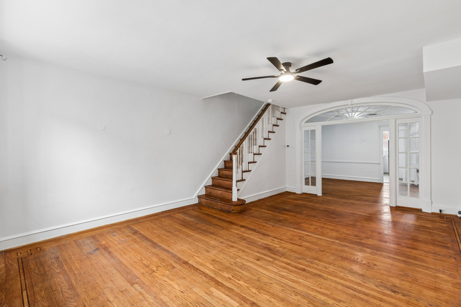 Living room - 4BR/3BA renovated across from La Salle; basement suite w/ own entrance, full bath. Townhome