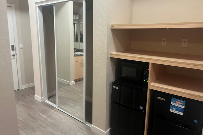fridge/microwave and closet area - The Suites at NAU