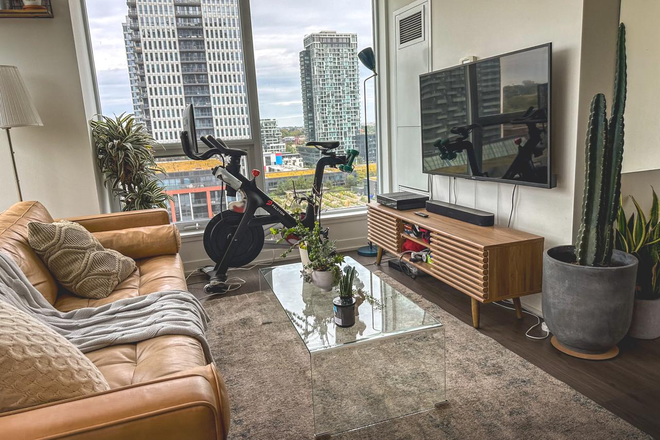 Living Room - Fully furnished, 2-bedroom, 2-bathroom condo with a den and balcony.