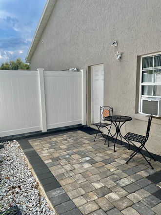 Patio/ entry - Home with separate Two level apartment 1bed 2 baths in quiet neighborhood 2-3 miles from campus.