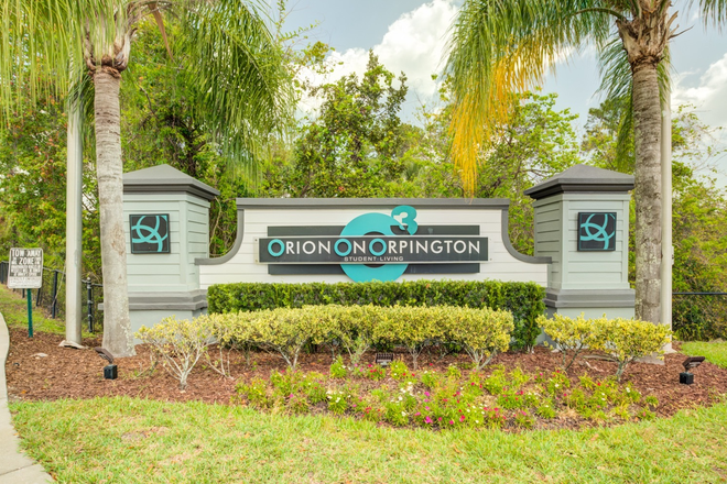 Orion-on-Orpington-Off-Campus-Apartments-Near-UCF-Orlando-Front-Entrance-Monument-Sign-and-Landscaping - Orion on Orpington Apartments