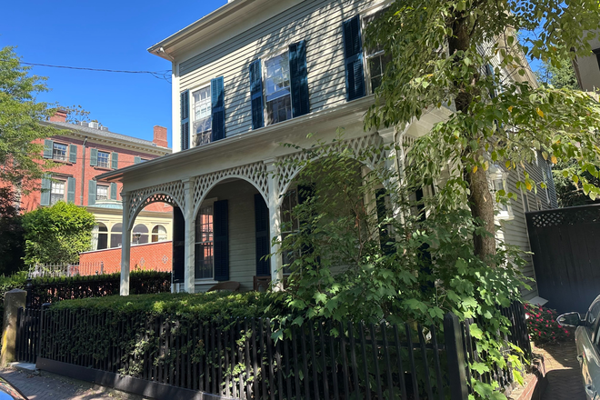 Front of house with porch with sitting area. - Share beautiful 3-bedroom home 1 block from Brown University with 2 female Brown students.