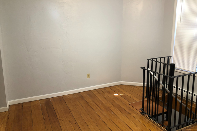 Living Room view 2 - Beautiful, renovated 2BR townhouse style unit with office, near T, with laundry in building