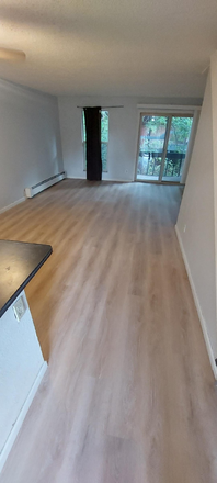 Living room with new flooring - On the Hill/ 2 bedroom condo/very clean