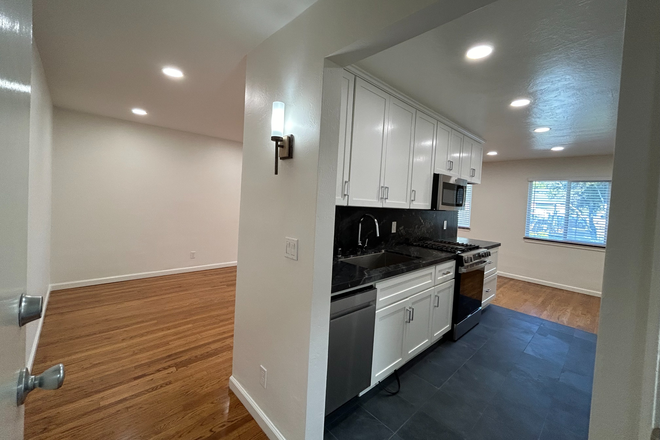 Entry with view of kitchen - Spacious and  Light Filled, Wood Floors, One Mile to UC Apartments