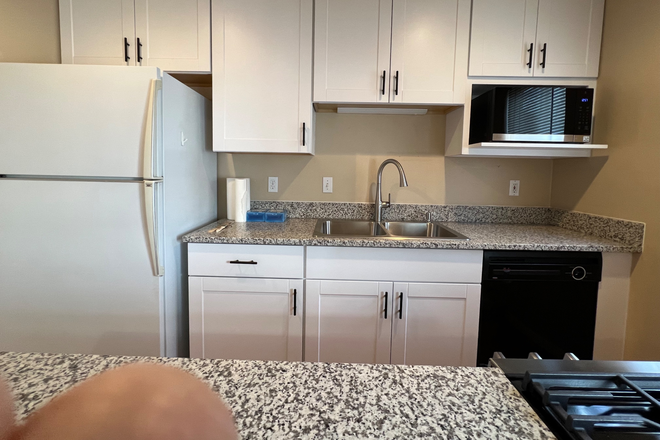 Completely updated kitchen with new granite counter tops, new cabinets and new appliances. - Clean Spacious 3 Bedroom, 4 Bath Boulder Townhome near 47th & Valmont. Newly Updated Kitchen.