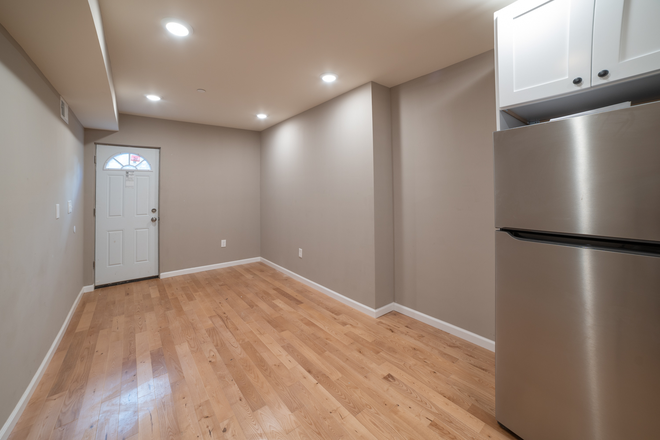 Living Room - OCP - New Construction Luxury Unit With Patio - 3 Bed 3 Bath Apartments