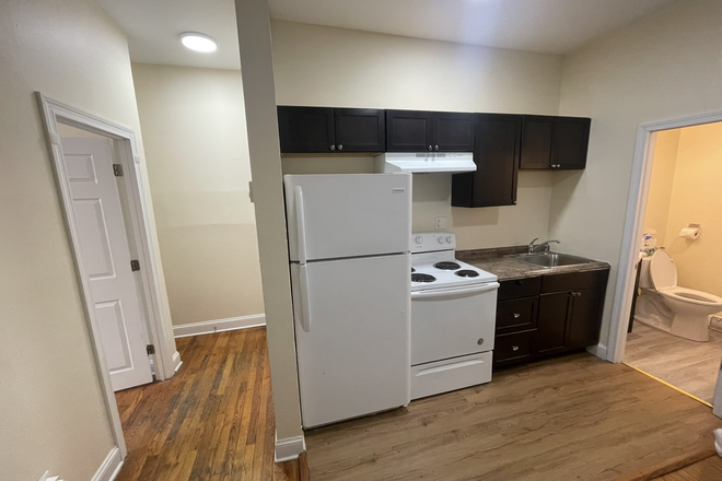 Visit hubrealtyproperties.com - Recently remodeled one bedroom on Green line T, in Mission Hill, free parking space